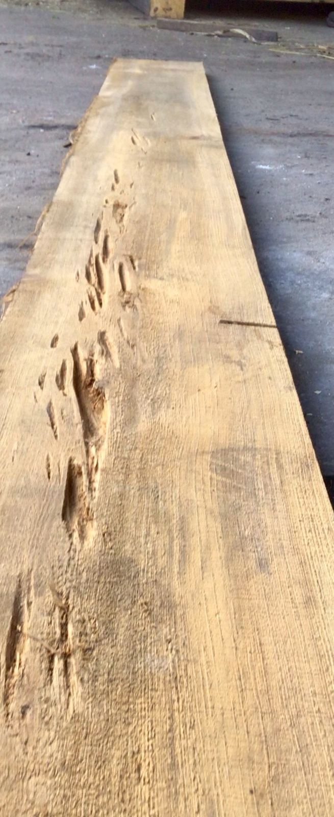 Long pecky cypress board with pocketed grain